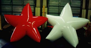 Radiant red and white helium filled star balloons are great for parades!!